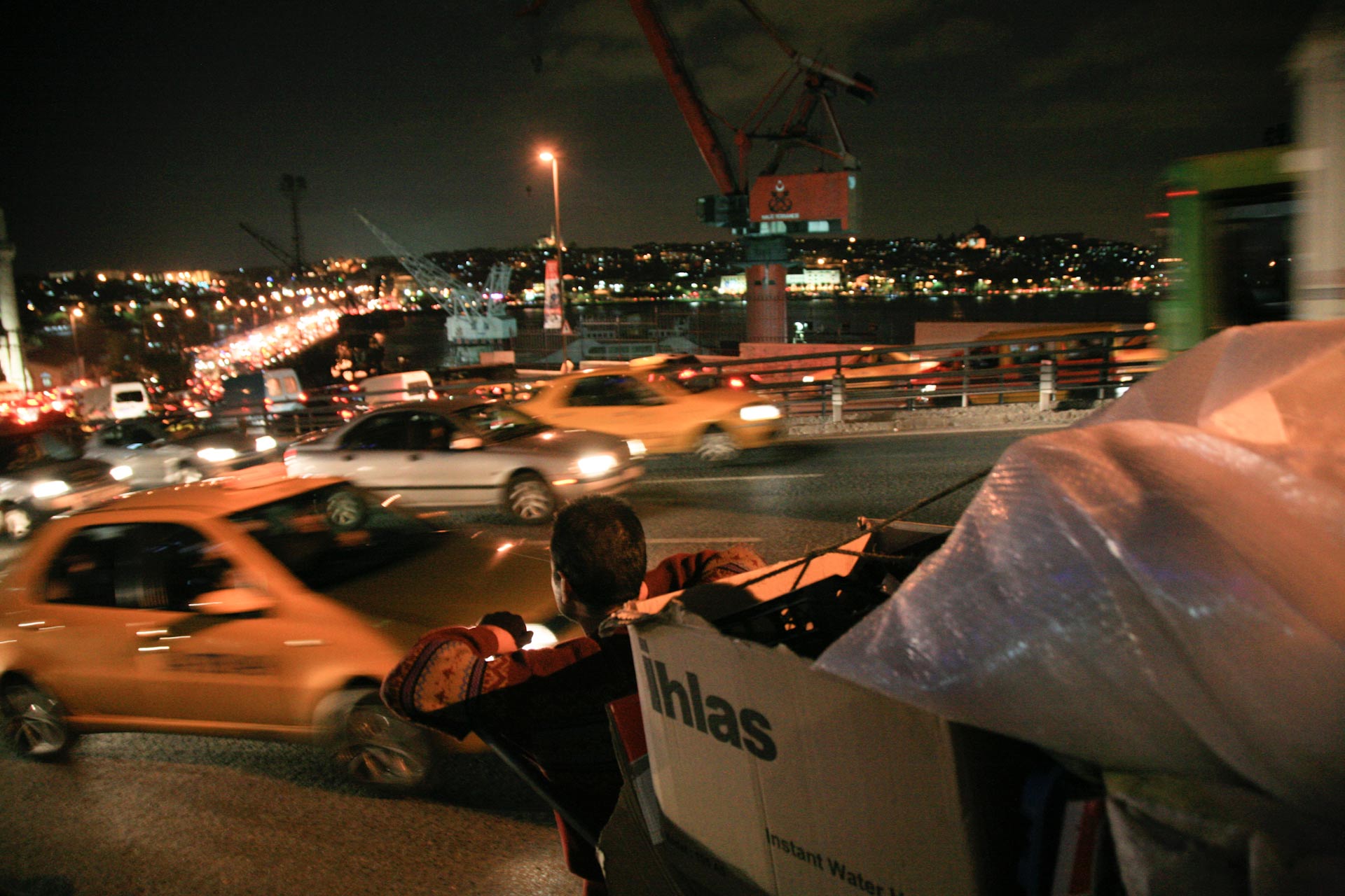 Waste piker tries to make his way through the havy evening traffic in Şişhane, Beyoğlu