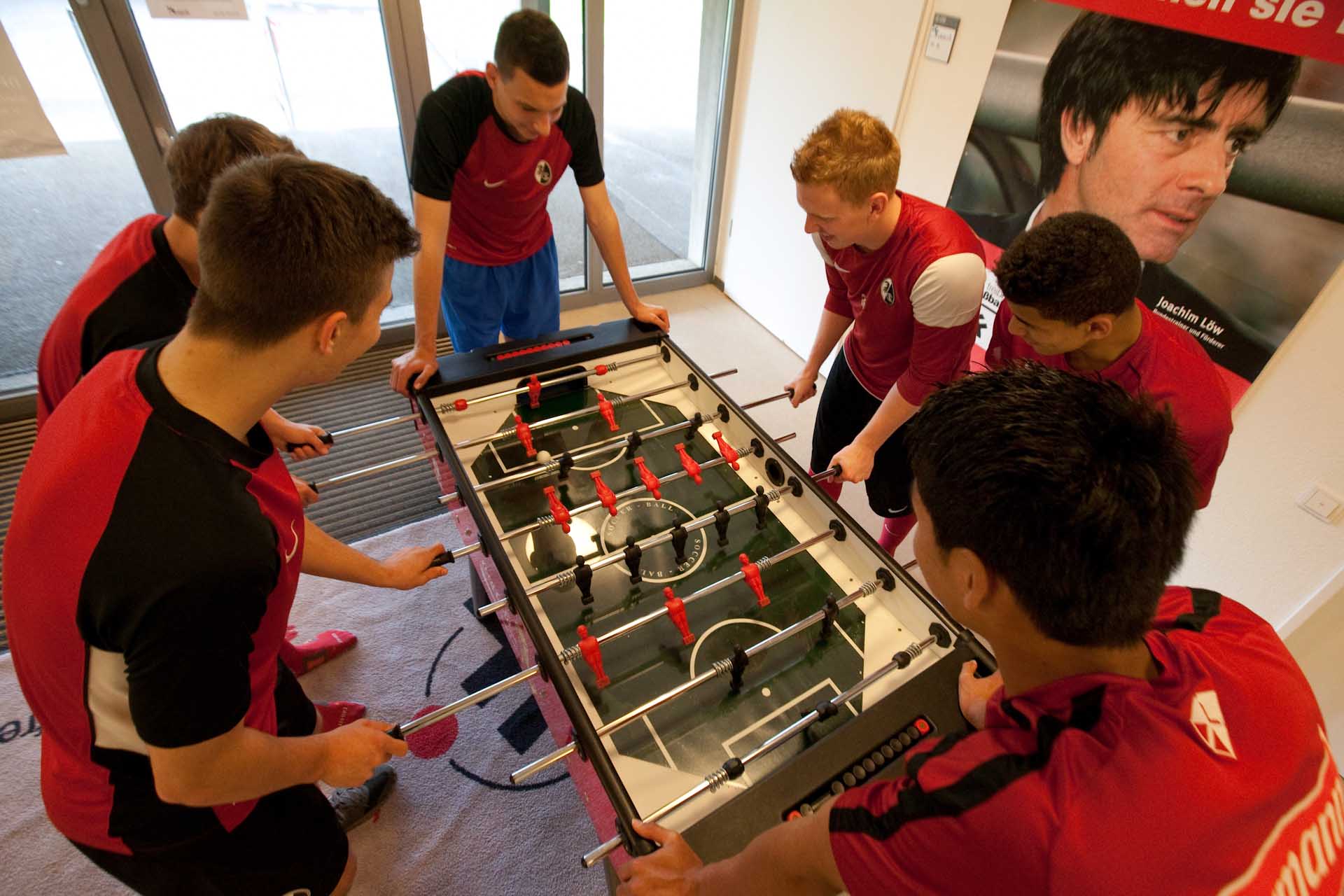Youngsters play table football at Freiburg's academy