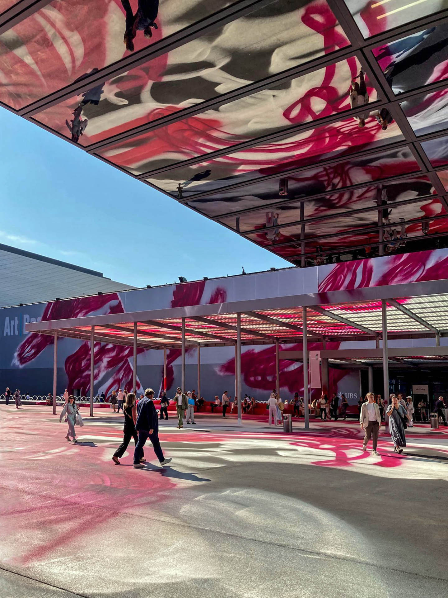 Katharina Grosse, "Choir", 2025, acrylic on asphalt and fabric – a huge graffiti painting on the Messeplatz in Basel.