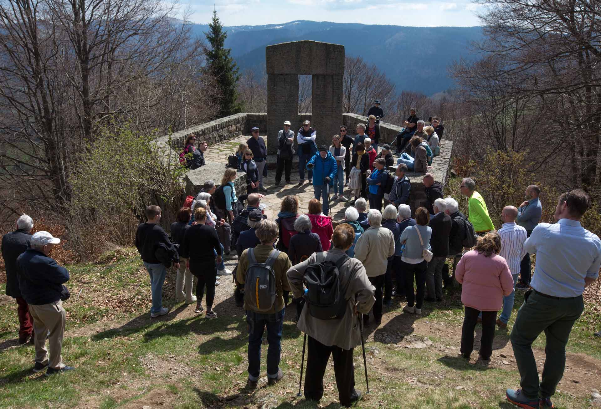 People gather at the memorial to the victims of the disaster, erected by the Nazis near Hofsgrund, to commemorate the tragedy. Bernd Hainmüller, a retired teacher from nearby Freiburg who has been working for 26 years to uncover the true circumstances behind the tragedy, explains the history of this site.